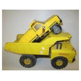 (2) Metal Tonka dump trucks. Largest measures 19"