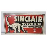 Metal "Sinclair Motor Oils" sign with dinosaur.