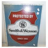 Metal "Smith & Wesson" sign. Measures 16" x