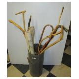 Metal can filled with (10) Vintage canes and