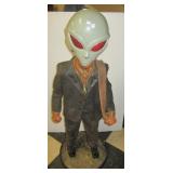 Paper Mache? man statue with an alien mask.