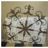 Ornate metal wall décor piece. Measures 50"