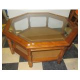 Beveled glass top two tier octagon coffee table.