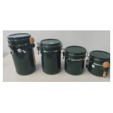Four piece green ceramic canister set with wooden