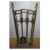 Four piece metal fireplace set.