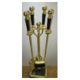 Four piece brass fireplace set.