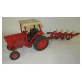Vintage tractor with disk plow. Measures 22"