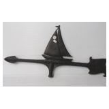 Metal weather vane top featuring sailboat.