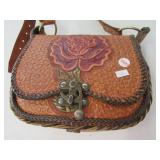 Tooled leather purse.