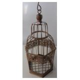 Small metal bird cage. Measures 13" tall.