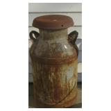 Vintage milk can. Measures 24" tall. Has rust.