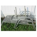 (2) Patio loungers and small glass top table.