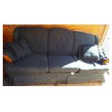Floral design couch. Shows wear.