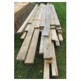 Large group of lumber including 2 x 6 and 2 x 4.