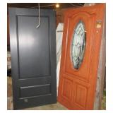 (2) Heavy entry style doors. (1) Features lead