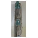 Wood fence post with (2) Railroad insulators.