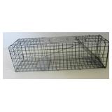 Animal live trap. Measures 7.5" h x 7" w x 24" d.