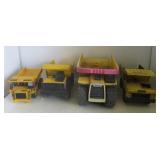 (4) Tonka dump trucks. Largest measures 18" long.