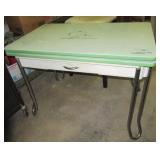 Vintage metal fold out table. Measures 30" h x