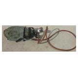 Small tank with hose and gauge.