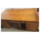 Oak computer desk with six drawers and keyboard