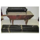 Vintage paper roller? And cot?