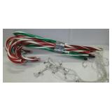 Group of outdoor lighted candy canes.