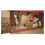 Shelf full of items including several pair of
