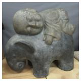 Heavy Buddha baby riding elephant lawn décor.