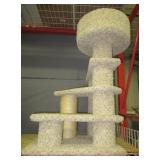 Large cat climbing tree. Measures 39" tall.