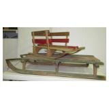 (2) Vintage wood sleds in various designs.