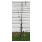 (8) Vintage fishing poles. Some have rust and