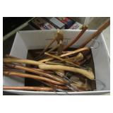 Box filled with vintage wood hangers. Some with