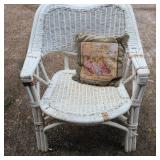 White Wicker Chair and Decorative Throw Pillow
