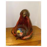 Figurine Of Woman Holding Basket of Flowers