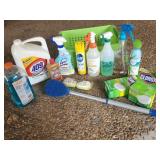 Green Bin Full of Cleaning Supplies