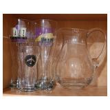 Pitcher and tall beer glasses