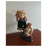 Blonde Doll on Carousel Horse