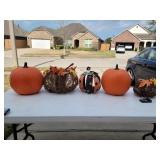 5 decorative Halloween pumpkins.