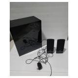 Computer speakers and a Samsung submuffler.