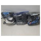 Three large ziplock bags full of power cords and