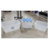 Three storage containers one of them with