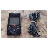 Sony MP3 Player with headphones.