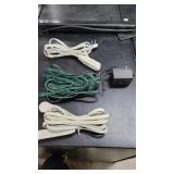 Three extension cords and a RYOBI charger