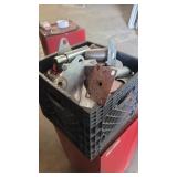 A bin of castro parts and pieces and table leg