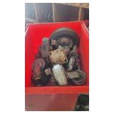 A bin of miscellaneous casters parts and pieces