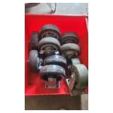 A bin with 10 casters. 2 sets of 3 and 2 sets of