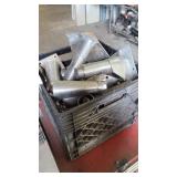 A bin of miscellaneous table legs and caster