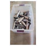 A bin of miscellaneous table, legs and Castro