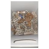 Plastic tub full of chain locks and other stuff